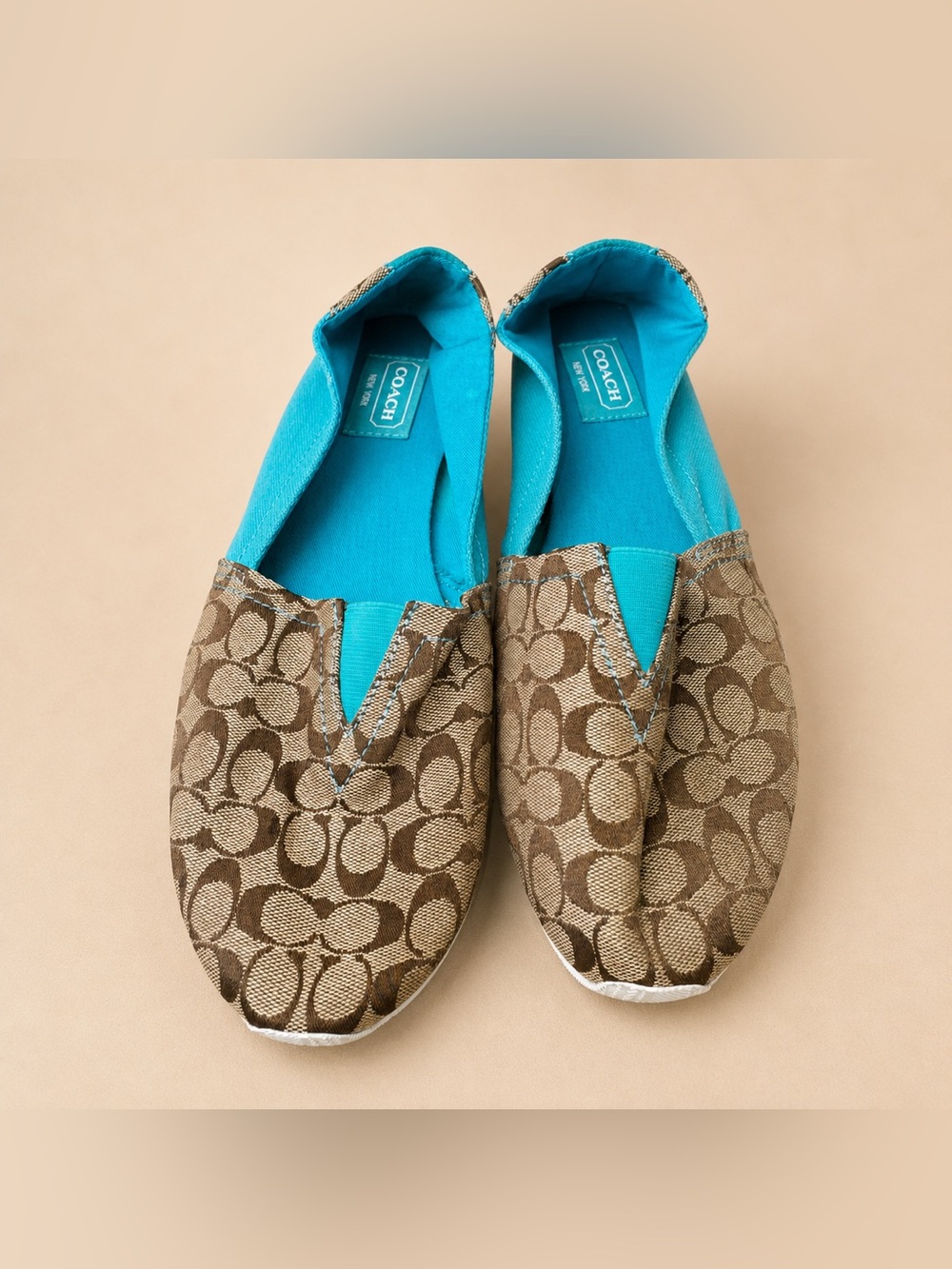 Coach Women’s Brown Signature Canvas Slip-Ons with Turquoise Lining